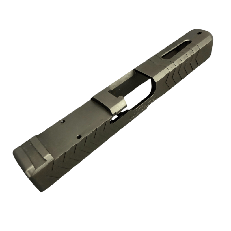 Close-up of a dark gray handgun slide with serrated edges and an ejection port, viewed from the side. - Glock 17 Gen 5 Black DLC RMR Cut Slide | Top Window Port , Mid State Firearms