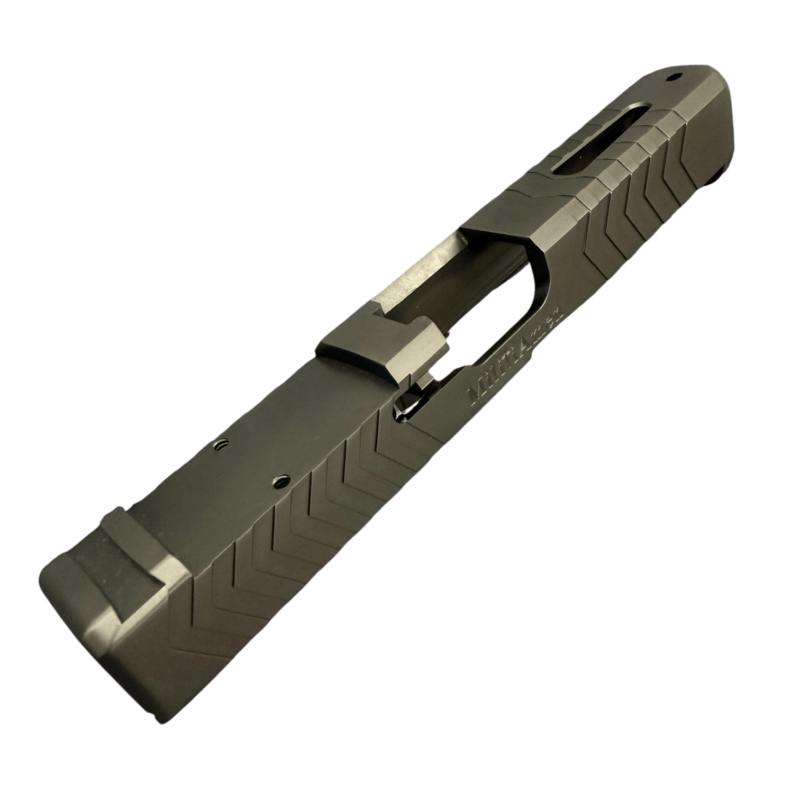 Close-up of a metal pistol slide with angular serrations and an ejection port - Glock 17 Gen 5 Black DLC RMR Cut Slide | Top Window Port , Mid State Firearms