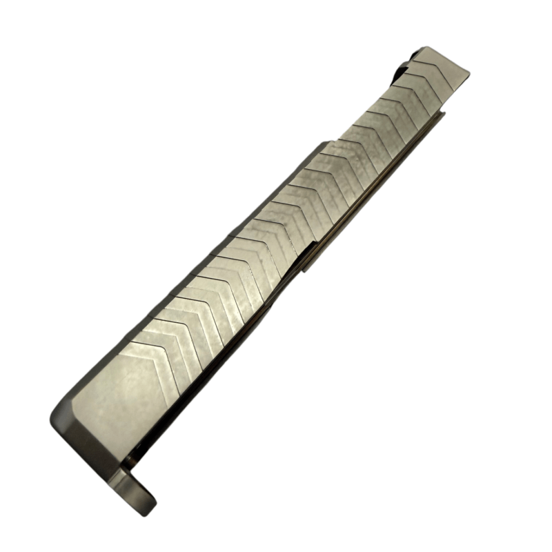 Close-up of a metal staple strip extending diagonally across a white background. - Glock 19 Gen 5 RMR Cut Slide, Zigzag Serrations | Top Window , Mid State Firearms