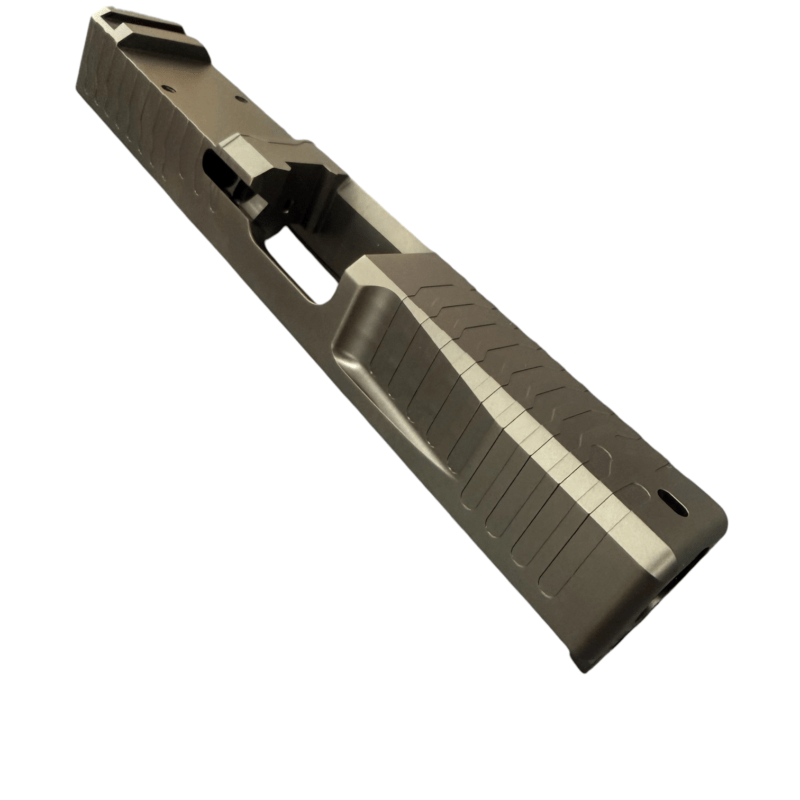 Close-up of a handgun slide with serrated sides, viewed diagonally on a white background. - Glock 19 Gen 3 RMR Slide | Black DLC - Matrix Drip Serrated , Mid State Firearms