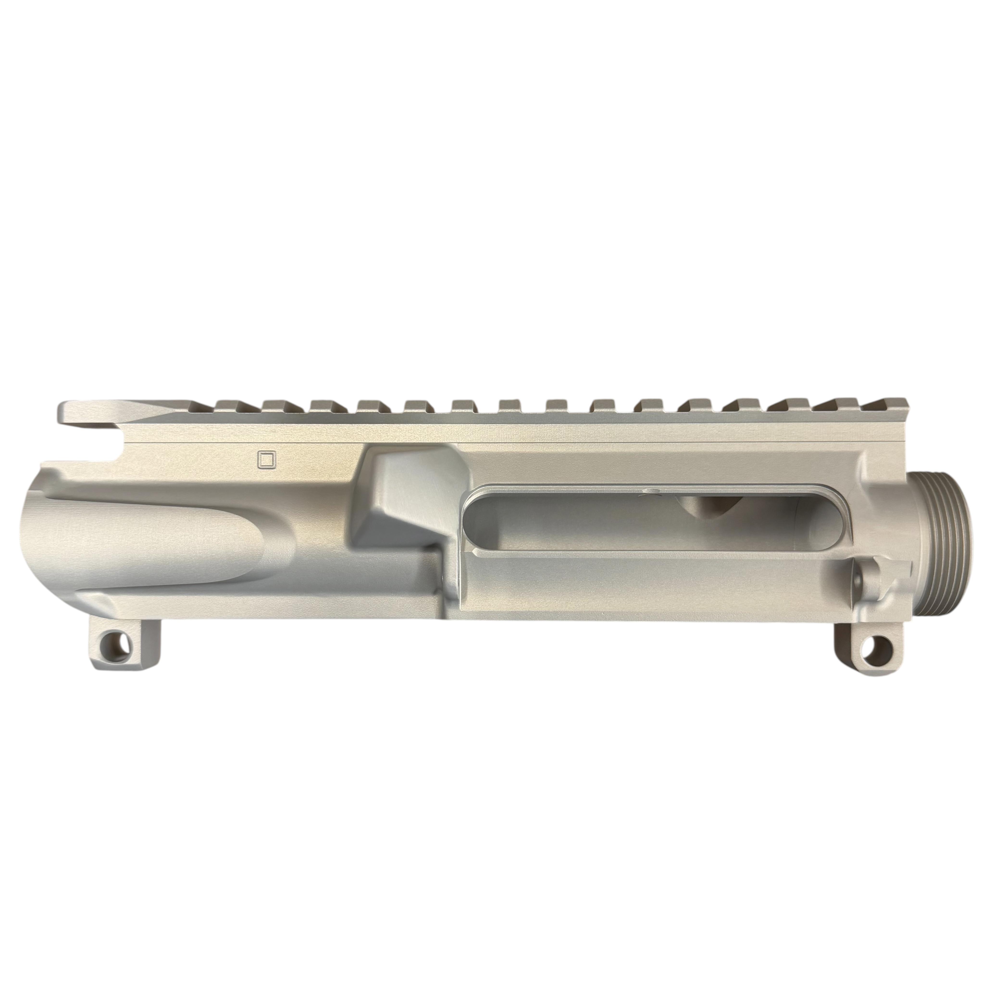 Close-up of a metal firearm upper receiver with a long Picatinny rail along the top, ready for accessories.